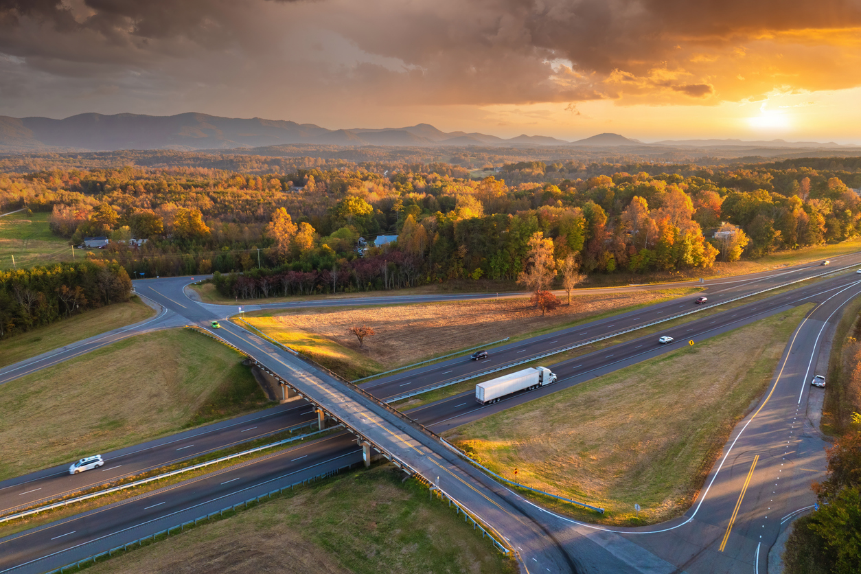 Freeway overpass junction with fast moving traffic cars and trucks