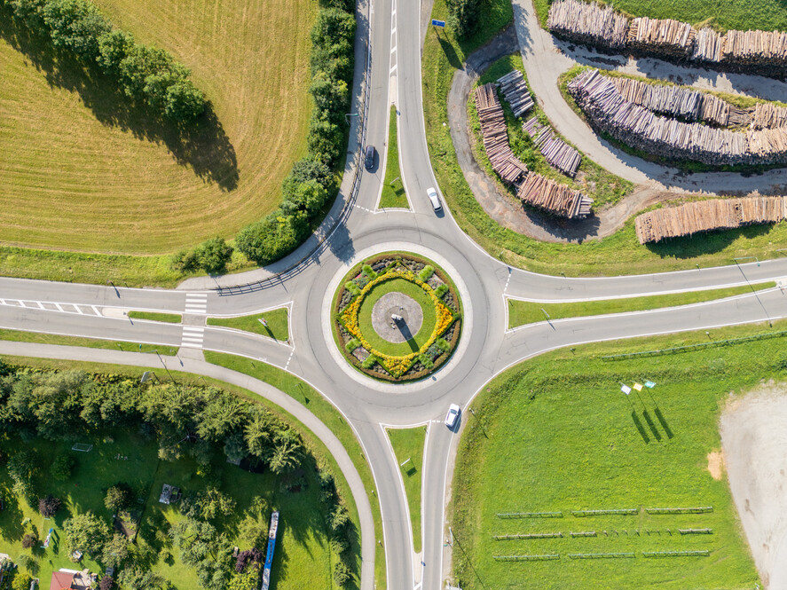 Aerial View of a Circular Roundabout in a Green Landscape