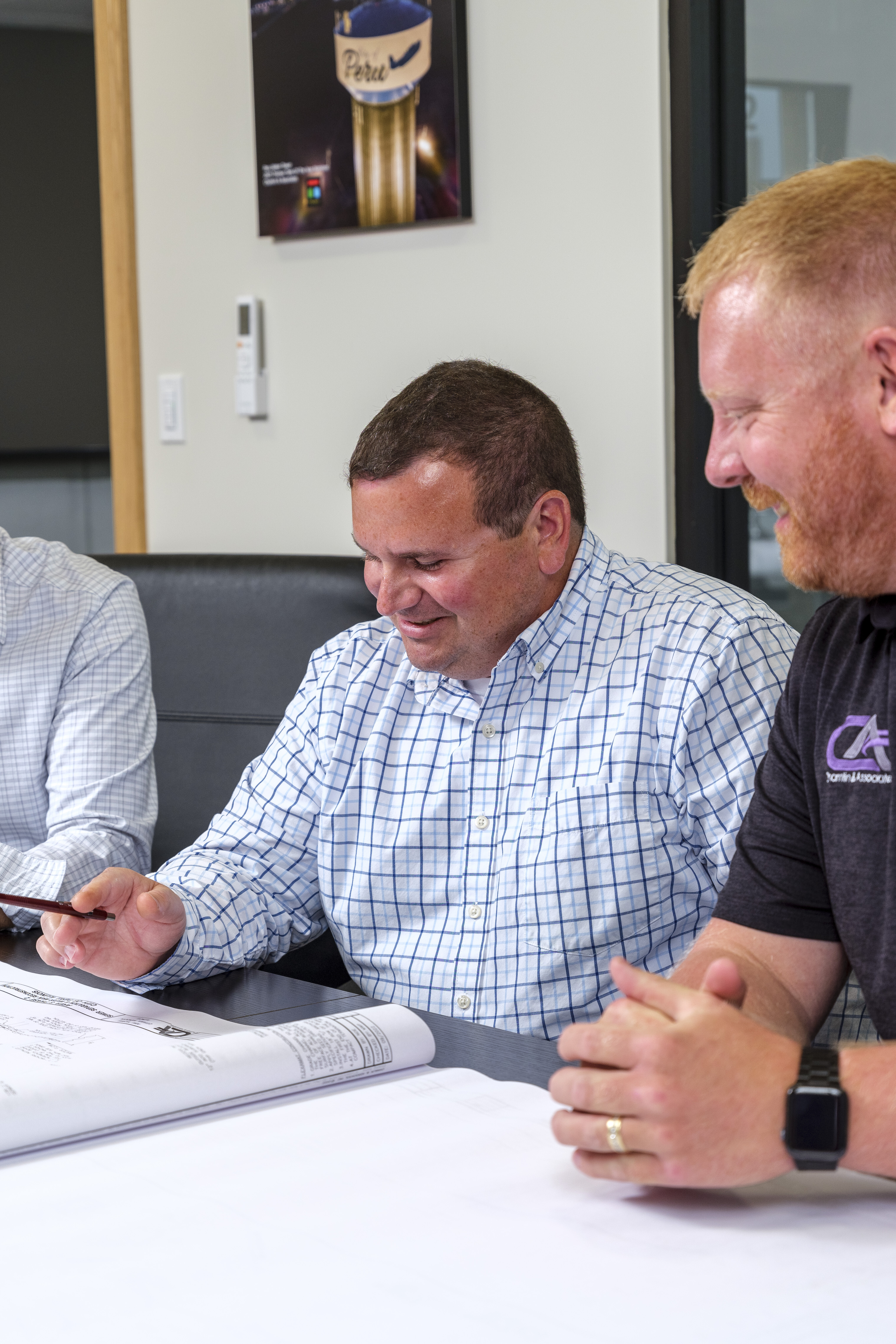 Men looking at construction plans