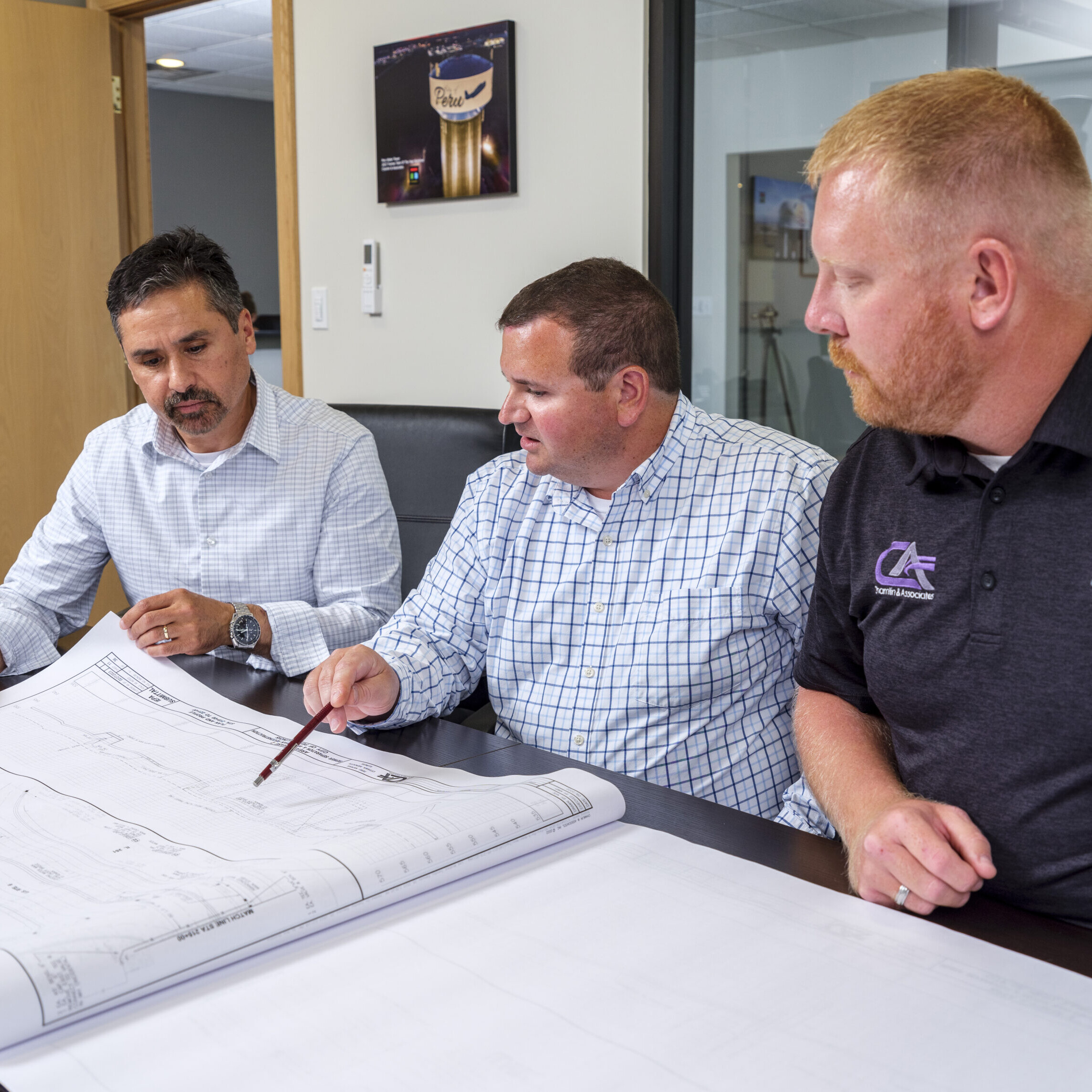 Men looking at construction plans