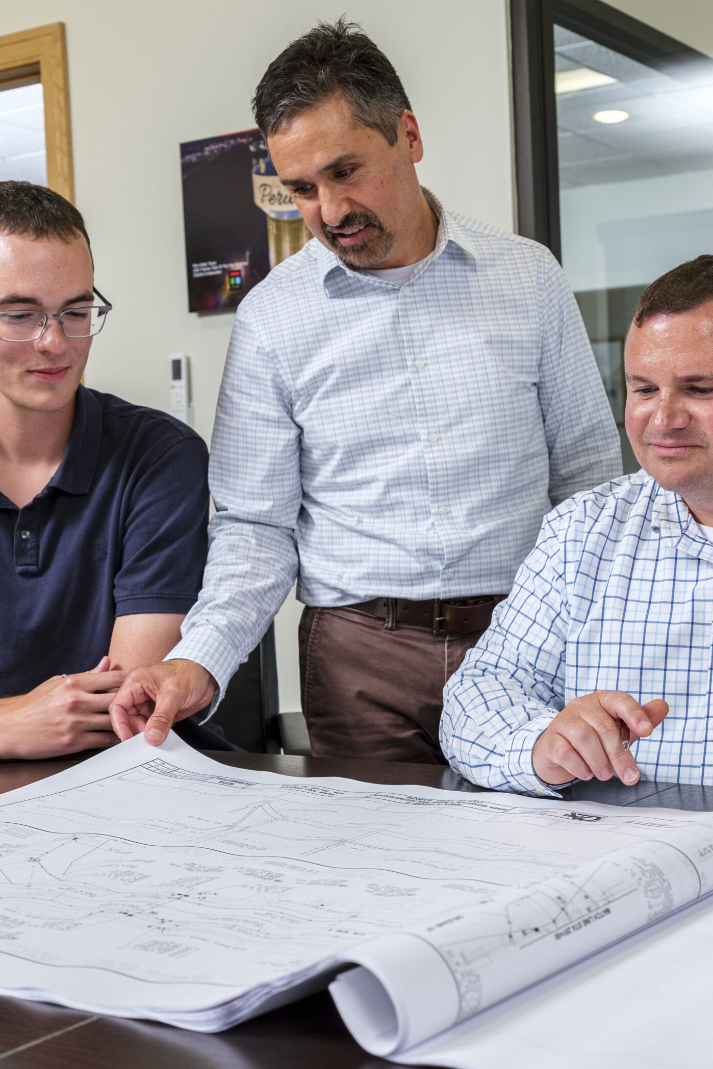 Men looking at construction plans